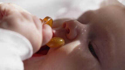 Cute newborn baby girl relaxing with pacifier. Adorable child sucking dummy.  - Powered by Adobe