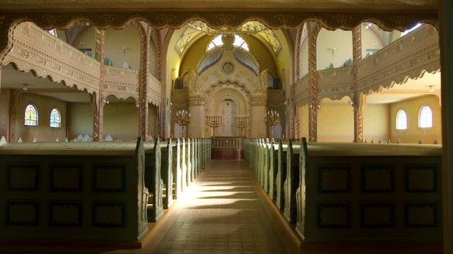 Exploring the stunning interior of a historic synagogue in Subotica Serbia during midday sunlight