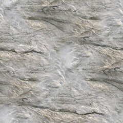 A gray and white marbled stone surface with swirling striations and layered texture, raw and organic.