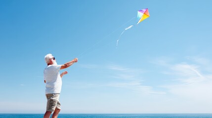 Elderly man with white hair wearing sunglasses, joyfully flying a colorful kite on a sunny beach, with clear blue sky and ocean waves in the background, capturing the essence of leisure and happiness
