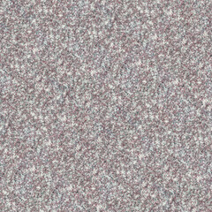 A grainy pattern of multicolored noise, resembling static with speckled shades of gray, white, and brown.