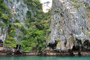 The beautiful of Hong island in Thailand with lush greenhills and golden beaches surrounded by...