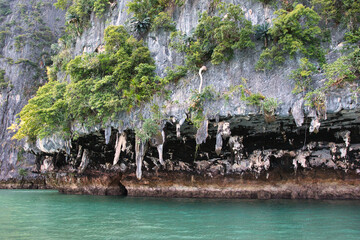 The beautiful of Hong island in Thailand with lush greenhills and golden beaches surrounded by...