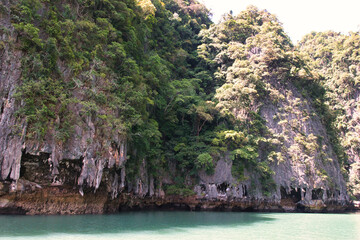 The beautiful of Hong island in Thailand with lush greenhills and golden beaches surrounded by...