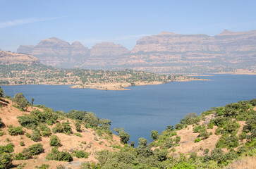 Serene landscape with a Arthur lake at Bhandardara, Maharashtra, India.