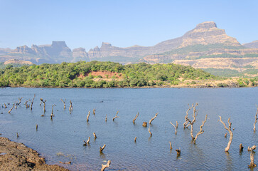 Serene landscape with a Arthur lake at Bhandardara, Maharashtra, India.