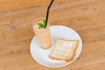 Milk melon Smoothie in glass with Roast bread