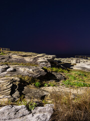 Rock cliff platform view at night.