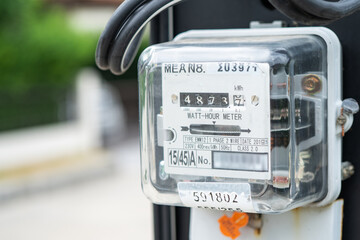 Electric measuring power meter for energy cost at home and office.
