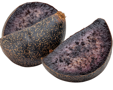 Two cuts of black potato. Speckled gold rind