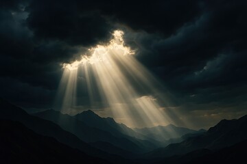 Sunlight beams piercing dark clouds over mountains. Dramatic light rays breaking through storm sky. Hope and spiritual concept.