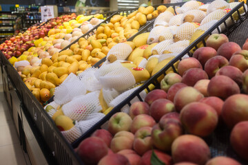 Fresh fruits on shelves in supermarket