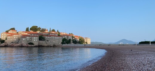 Montenegro Adriatic Sea coast Sveti Stefan, sandy beach and next to luxury resort island, panorama
