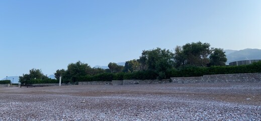 Montenegro Adriatic Sea coast Sveti Stefan, sandy beach and next to luxury resort island, panorama