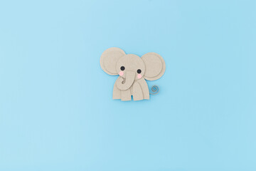 Minimal paper elephant character on soft background, perfect for children publishing, baby decor, early education apps, craft activities, kids product branding, packaging design,