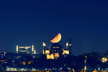 A stunning night view of Istanbul featuring the illuminated Hagia Sophia and Blue Mosque with a...