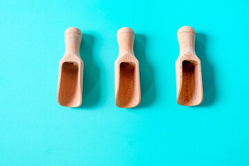 Wooden spoon, chopsticks and equipment on a color background. Top view.