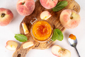 Flat chinese donuts fig peach jam, homemade confiture preserves with fresh fresh fig peaches and mint in white background copy space