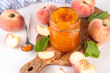 Flat chinese donuts fig peach jam, homemade confiture preserves with fresh fresh fig peaches and mint in white background copy space
