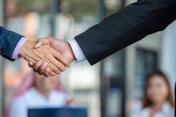 handshake after partnership meeting success business contract deal. Teamwork congratulate...