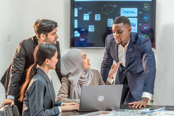 Manager Speaker Motivational multiethnic teamwork by explain present data in laptop notebook to colleagues decide. coworker coach explain Analysis Statistic Report presentation to multiethnic teamwork