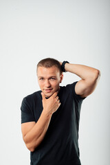 Confident Young Man Posing in Studio