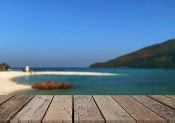 Wooden table top on the beach or sea.Party on the beach  sunshine time concept.For montage product display or design key visual layout.View of copy space.