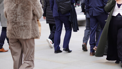 People walking down the street, city bustle, everyday motion