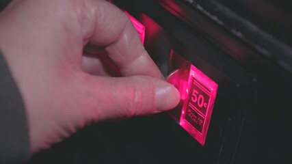 Multiple quarters inserted into coin mechanism arcade 4k
