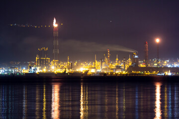 High-quality night shot of İzmit Tüpraş oil refinery showcasing vibrant industrial lights and...