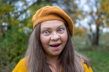 Amazed woman stares in shock, eyes wide open, bulging eyes, expressing disbelief and unexpected news, human emotion