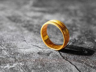 gold ring, gold price, gold jewelry, close up of gold ring on grey background