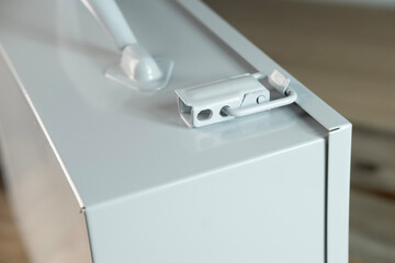 Gray metal case with transport handle, perfect for storage and organization, Industrial-style metal case with handle, ideal for tools, equipment, or supplies, portable safety