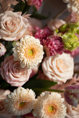 Elegant pastel floral arrangement featuring roses and chrysanthemums