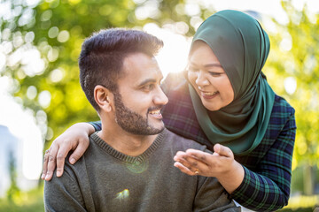 Portrait of happy muslim couple embracing each other in the city