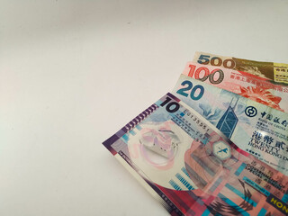 Several Hongkong dollar banknotes on a white background