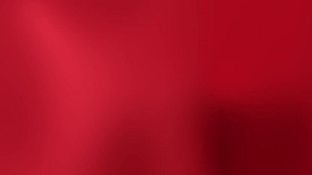 Animated red background gradient, ideal for minimalist backdrops.