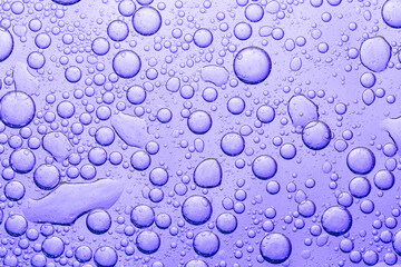 Close-up macro purple bubble texture,Colorful artistic of oil drop floating on the water. Abstract oil bubbles background. Macro shot. oil bubbles close up. water bubbles. Bright and unique oil drops,