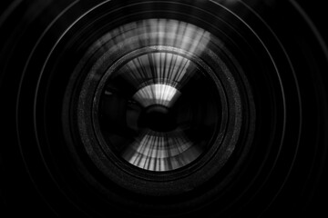 Close up of modern digital camera lense, a view of the front lens with flare effects