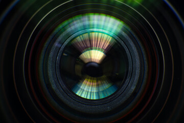 Close up of modern digital camera lense, a view of the front lens with flare effects