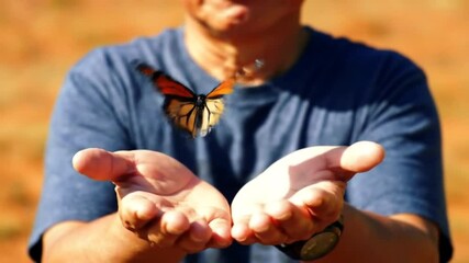 young man holding a small yellow flower - Powered by Adobe