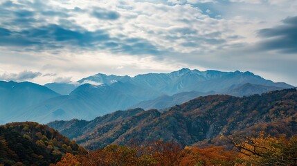 Fototapeta premium Autumn Mountain Distant View: Unveiling the Serene Tapestry of Seasonal Landscapes, Cultural Symbolism, and Natural Aesthetics in Scenic Overlooks and Panoramic Vistas