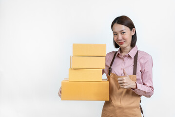 Beautiful asian woman posing with boxes and standing smiling on isolated white background. Shopping...