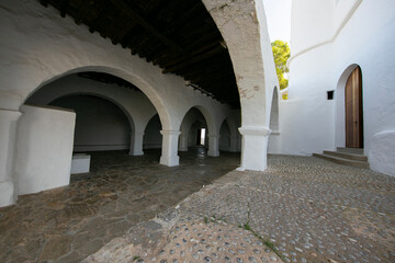 Obraz premium Beautiful white church of Puig de Misa in Santa Eulalia des Riu on the island of Ibiza.
