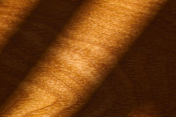 A close-up view of beautifully grained wood reveals rich, warm tones and smooth textures.