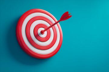 Red arrow hitting center of target on turquoise background