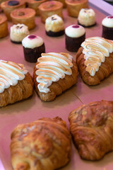 Delicious bakery display of pastries and cupcakes in a bright setting