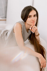 Woman with long hair sitting and chilling with a stylish woven tote bag