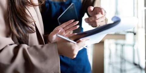 Entrepreneur presenting ideas with notes and tablet
