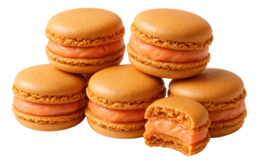 Stack of orange macarons filled with creamy salmon spread, one macaron with a bite taken.